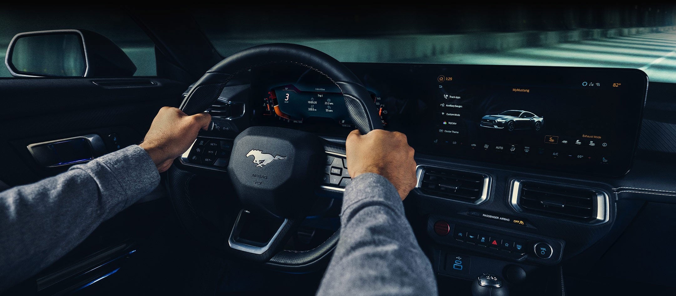A 2024 Ford Mustang® model interior with a person driving | Parks Ford of Wesley Chapel in Wesley Chapel FL